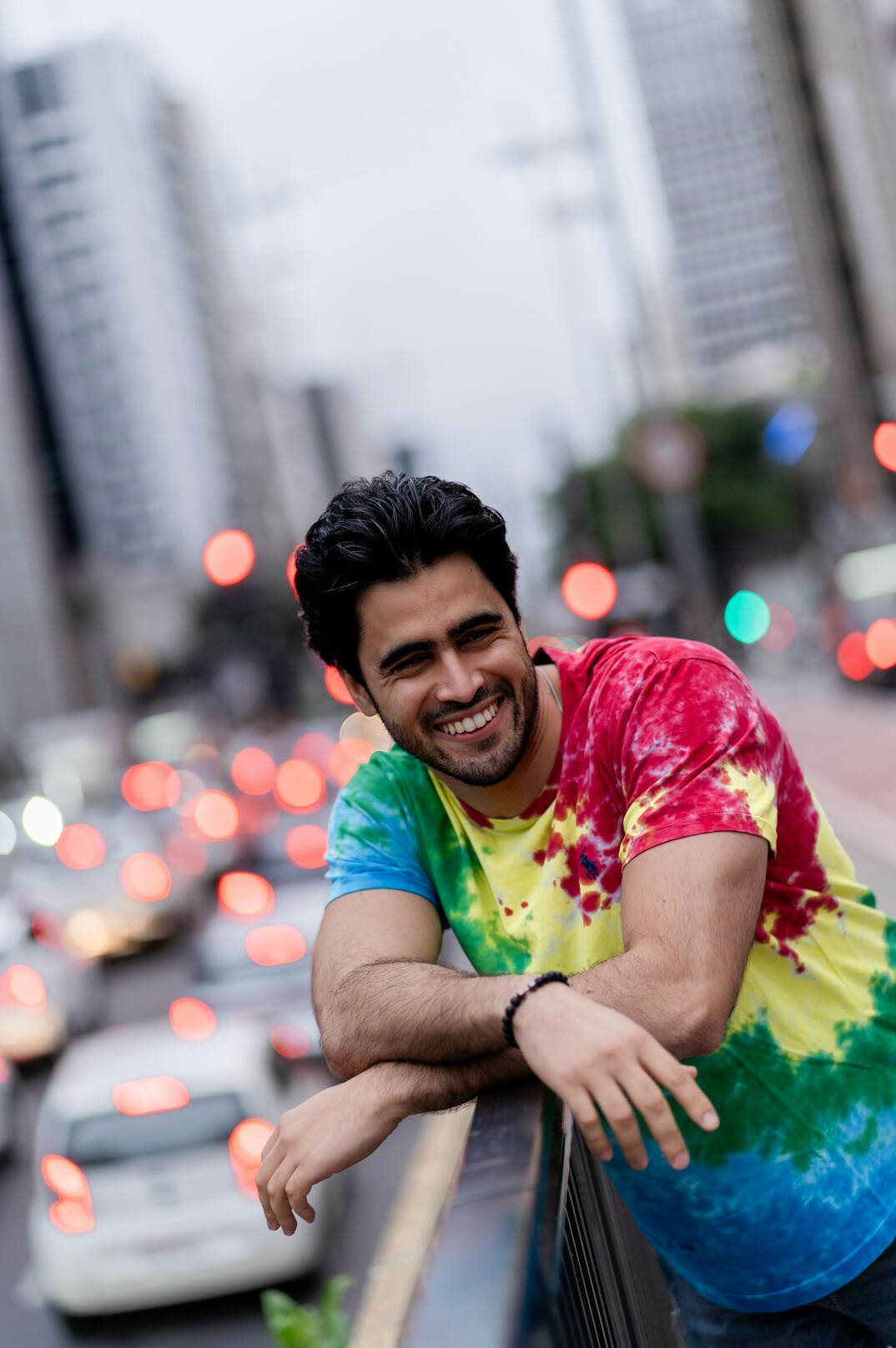 Studio portrait of a brazilian man with short beard smiling